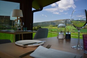Breakfast, lunch, dinner served; local cuisine, pool views 