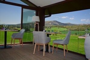 Breakfast, lunch, dinner served; local cuisine, pool views 