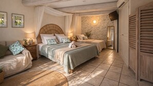 A bedroom with a large bed, two bedside tables, a mirror, and a wardrobe. - La Bastide Des Pins (Castillon-du-Gard)
