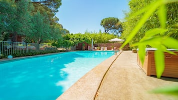 Seasonal outdoor pool, open 10:00 AM to 10:00 PM, pool umbrellas