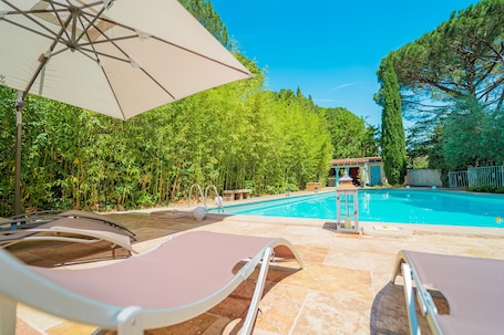 Seasonal outdoor pool, open 10:00 AM to 10:00 PM, pool umbrellas. La Bastide Des Pins
