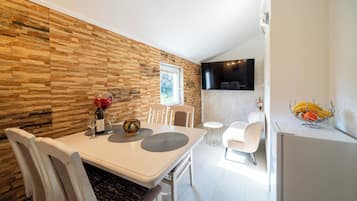 Panoramic Double Room | Living area | Flat-screen TV, DVD player