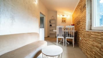 Panoramic Double Room | Living area | Flat-screen TV, DVD player