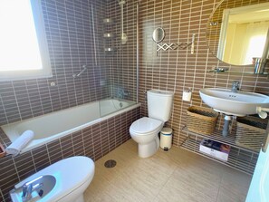 Bathtub, hair dryer, towels