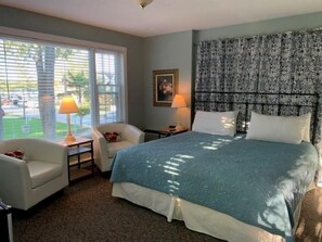 Premium Room, 1 King Bed, Fireplace, Partial Lake View | Free WiFi, bed sheets - Cedar Court Inn (Fish Creek)