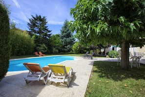 Seasonal outdoor pool, pool loungers