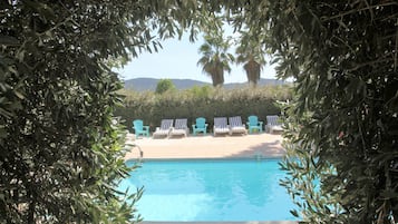 Seasonal outdoor pool, pool loungers