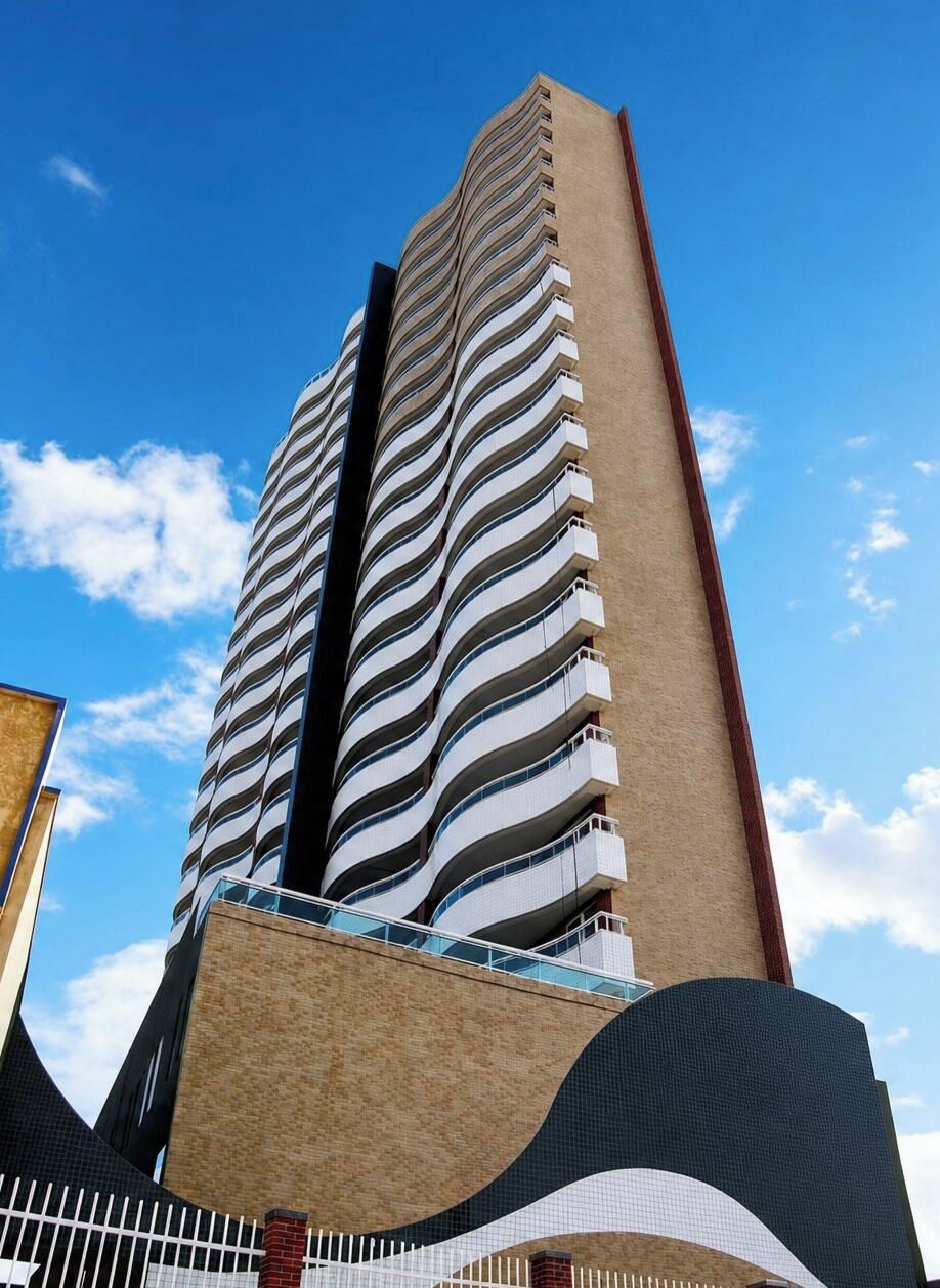 Um edifício alto com fachada curva e varandas.