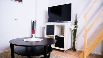 Business Loft, 1 Queen Bed with Sofa bed, Kitchen, Garden Area | Living area | 40-inch flat-screen TV with digital channels, TV