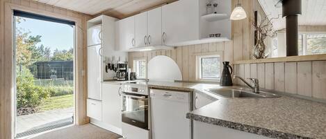 Fridge, stovetop, dishwasher, coffee/tea maker