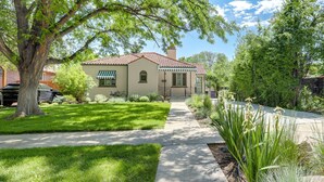 A single-story house with a red-tiled roof, a front porch, and a well-maintained lawn. - Park Hill Holly House - A Place To Call Home  
License: 2018-BFN-0000208 (Denver)
