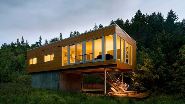 A modern house with a wooden exterior, large glass windows, and a staircase leading to an upper level. - Neal Creek Retreat - Urban Design, Gorgeous Rural Natural Surroundings (Hood River)