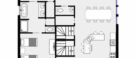 A hotel floor plan with a dining area, kitchenettes, a lounge, and a staircase.