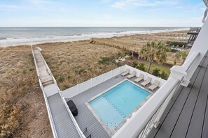 A rooftop pool with a view of the beach and ocean. - 🌊Less Stress: Oceanfront Home with Private Pool + Elevator🌊 (Kure Beach)