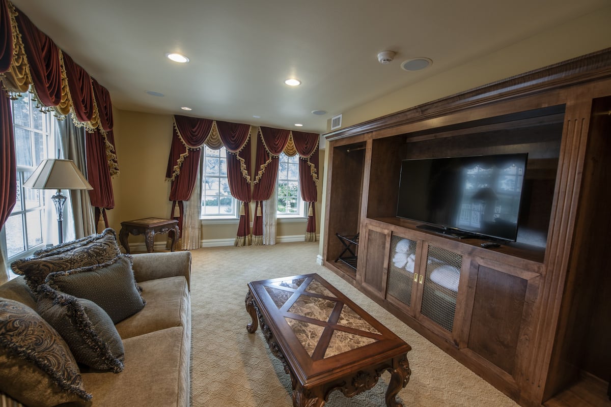 grand suite, 1 king bed with sofa bed, jetted tub | living room | led tv