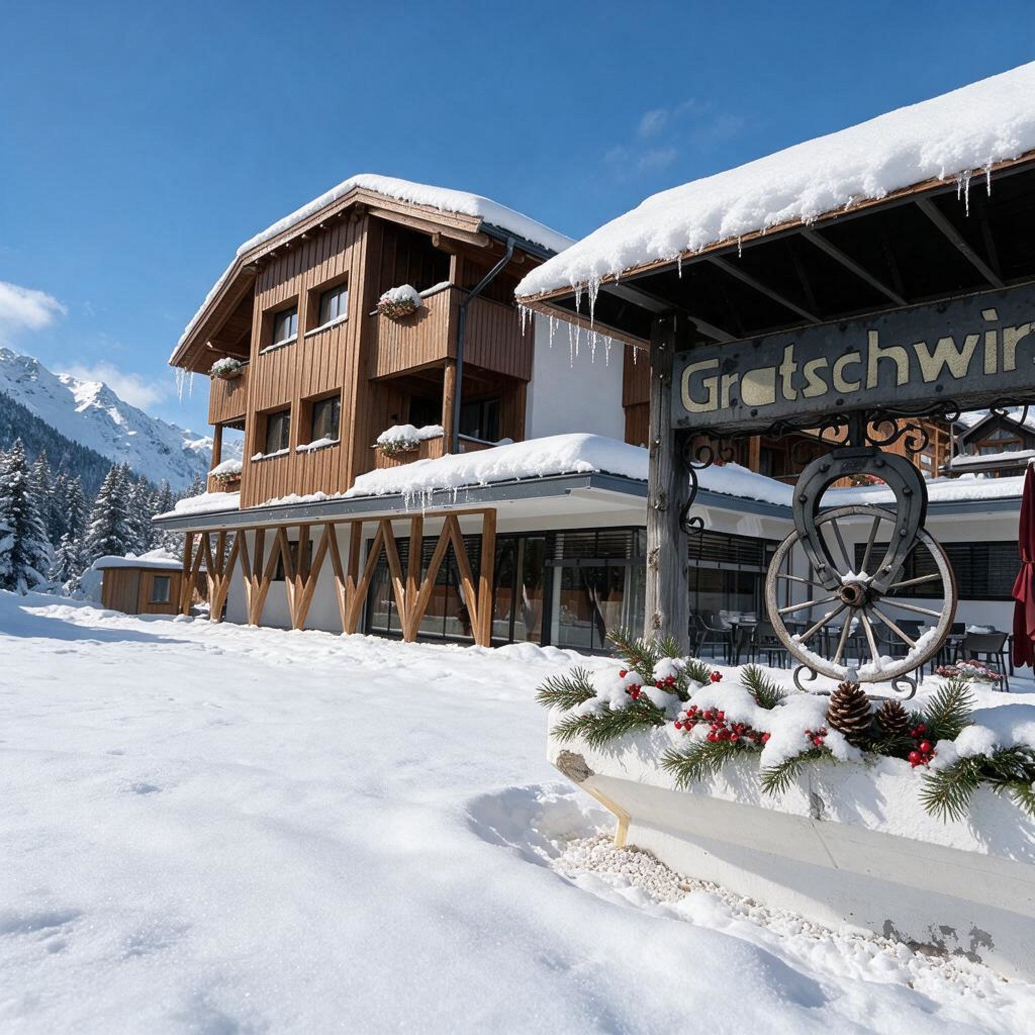Un bâtiment en bois, sur lequel on peut lire l’inscription « Gratschwirt », et un sol recouvert de neige.