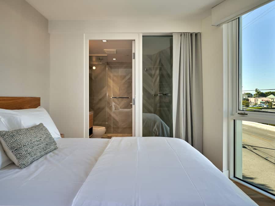 Premium bedding, memory-foam beds, desk, laptop workspace