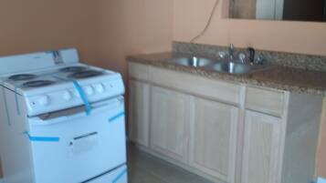 Standard Room, 2 Full Beds | Private kitchen | Fridge, microwave