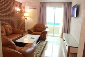 Suite, 1 Bedroom | Living room | 32-inch flat-screen TV with cable channels, TV - Adamaoua Grand Hotel (Douala)