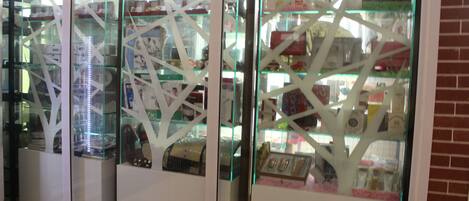 A display case with glass partitions and various items inside.