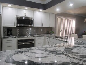 Fridge, microwave, oven, stovetop - Modern 2BR Condo · Two Pools & Hot Tubs · IMG 5 Mins · Anna Maria Island 15 Mins (Bradenton)