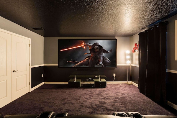 Indulge in the ultimate private cinema experience with loved ones in this expansive theater room