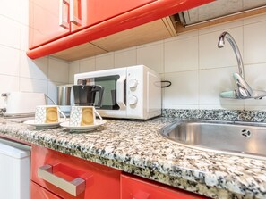 Fridge, microwave, coffee/tea maker, toaster