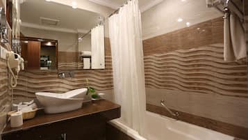 Deep-soaking bathtub, rainfall showerhead, free toiletries, hair dryer