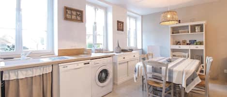 Fridge, stovetop, dishwasher, coffee/tea maker