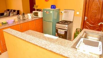 Standard Single Room, 1 Queen Bed (3) | Private kitchen | Full-size fridge, microwave, oven, stovetop