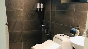 Shower, free toiletries, hair dryer, slippers