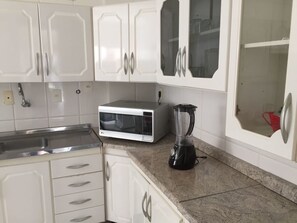 Traditional Apartment, 2 Bedrooms, Accessible | Private kitchen | Fridge, microwave, cookware/dishes/utensils - Recidencial Daniela (Balneário Camboriú)