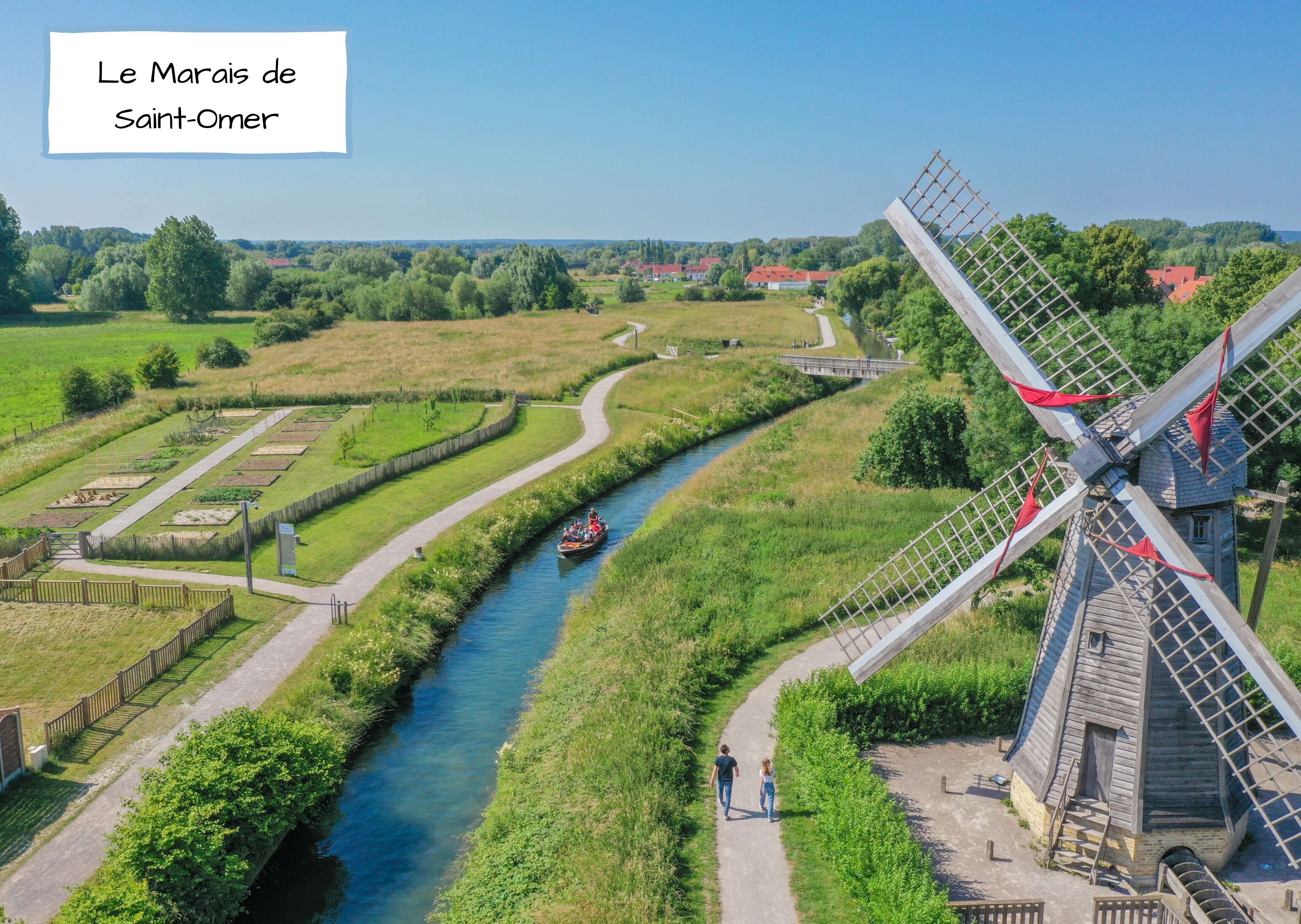A windmill, a river, and a pathway.