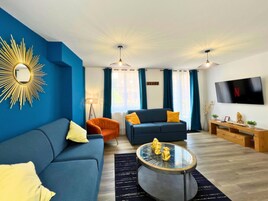 Exclusive Apartment | Living area | 102-cm TV with digital channels, Netflix, streaming services