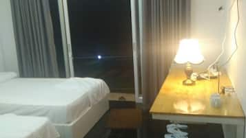 Twin Room with Garden View | Minibar, in-room safe, desk, blackout drapes