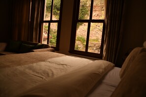 Suite Deluxe, vista al jardín | 2 habitaciones, minibar y caja de seguridad en la habitación 