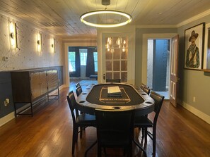 Enjoy games and gatherings in this room with a large poker table and comfortable seating.
