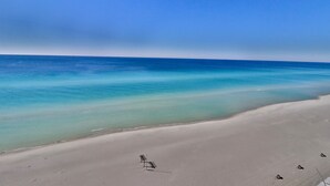 A beach with clear blue water and a sandy shore. - Tidewater 1011 10th Flr 2BR+Bunks 3BA Early Booking Discounts 2 Beach Chairs (Panama City Beach)