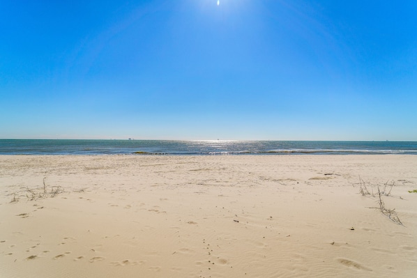 A beach with clear skies and calm waters.