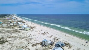 An aerial view of a beachside area with houses and a beach. - Gorgeous 4 Bdrm, 3 Ba Gulf Front Private Home, Sleeps 10 (Gulf Shores)