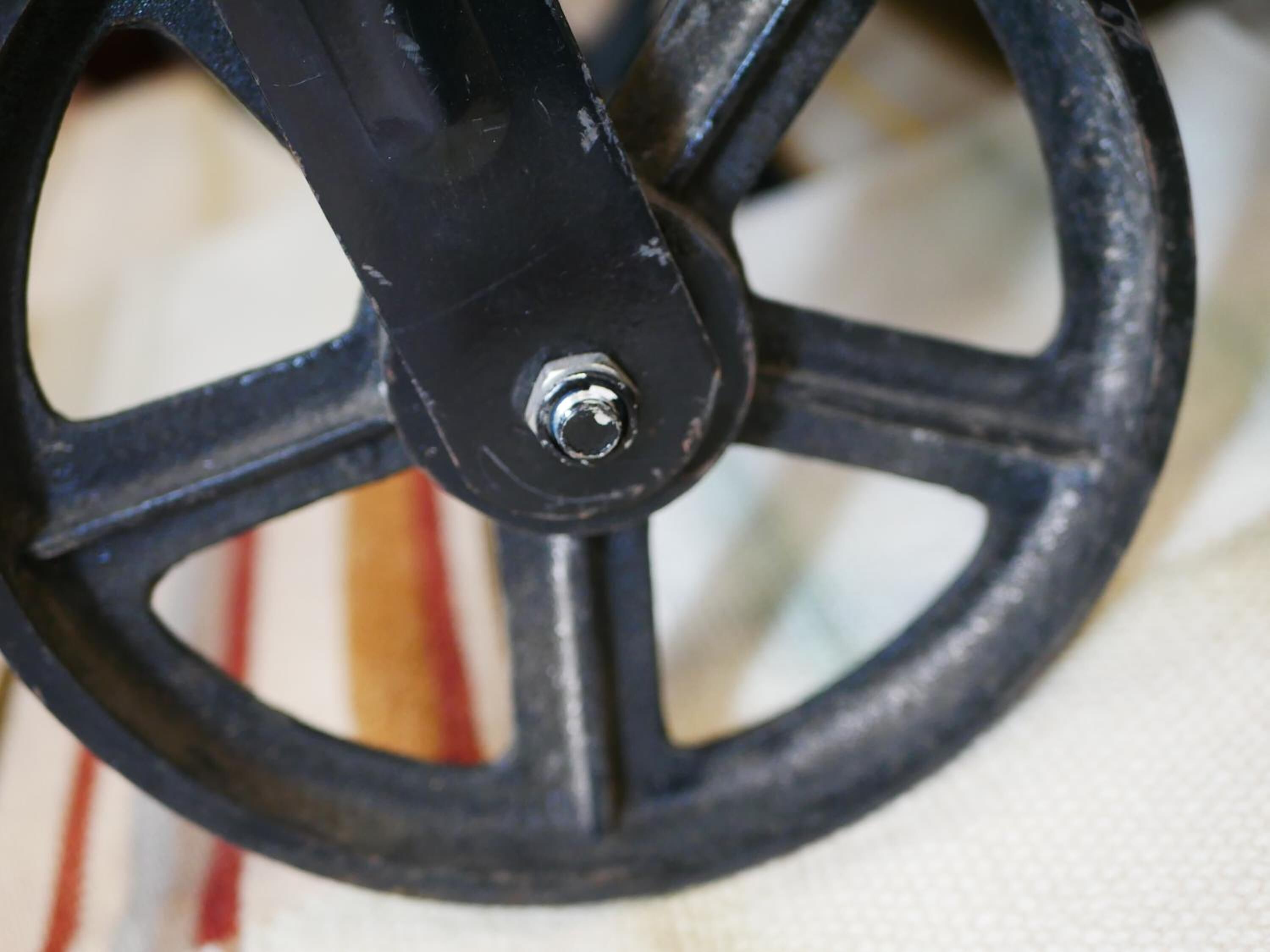 A close-up of a wheel with a bolt.