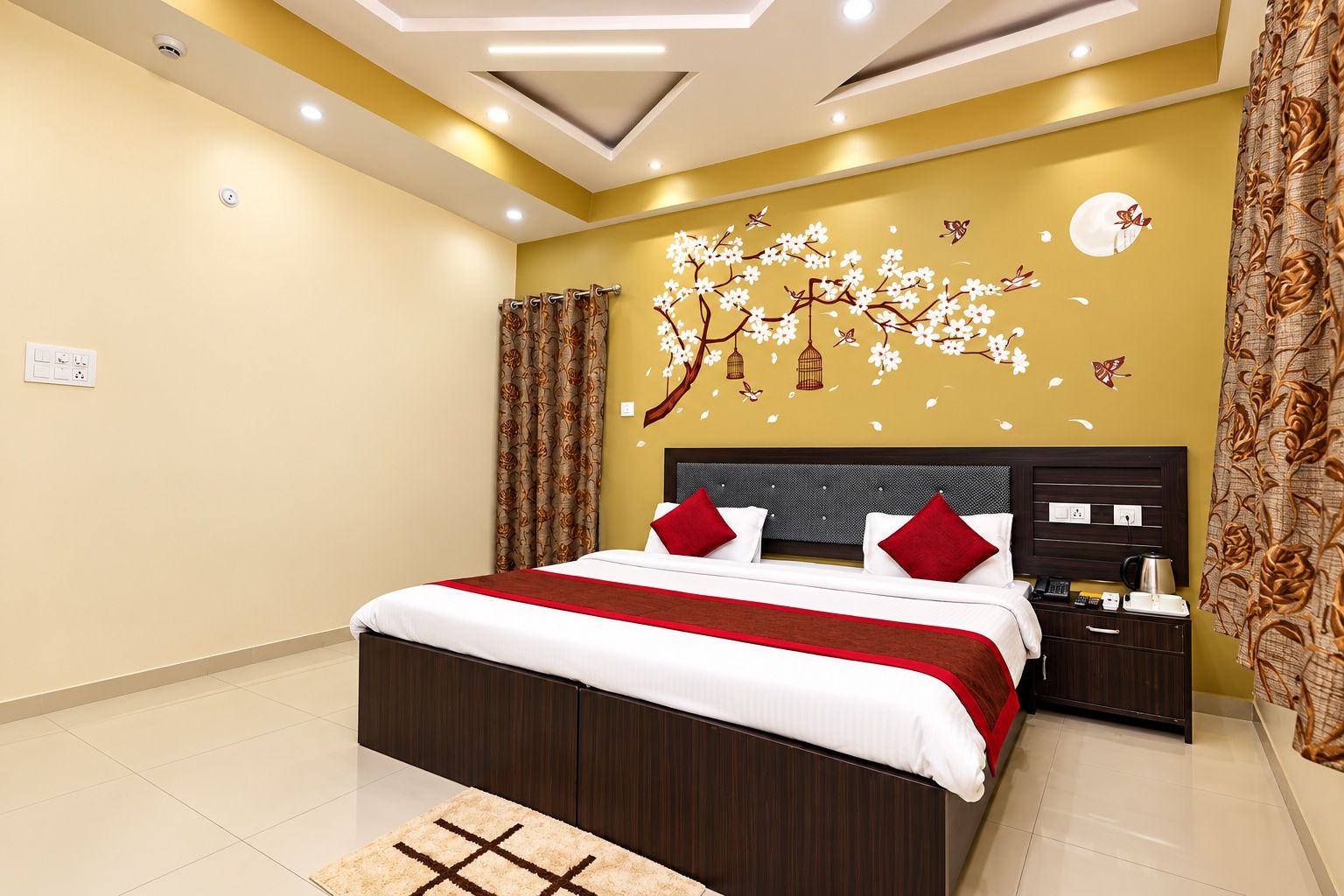 A modern bedroom with a large bed, a nightstand, a wall-mounted clock, and a decorative wall mural.