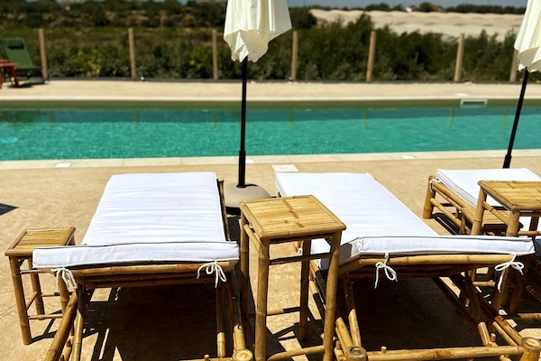Outdoor pool, free pool cabanas, pool umbrellas