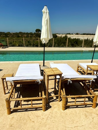 Outdoor pool, free cabanas, pool umbrellas