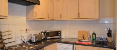 Deluxe Apartment, 2 Bedrooms | Private kitchenette | Fridge, microwave, coffee/tea maker, electric kettle