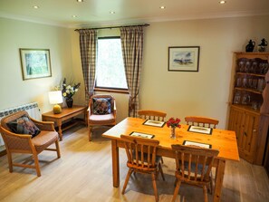 Dining - Buzzard - a beautiful 4 star holiday chalet surrounded by a true Highland landscape that can sleep (Crianlarich)