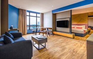 Family Suite | Living area | Flat-screen TV