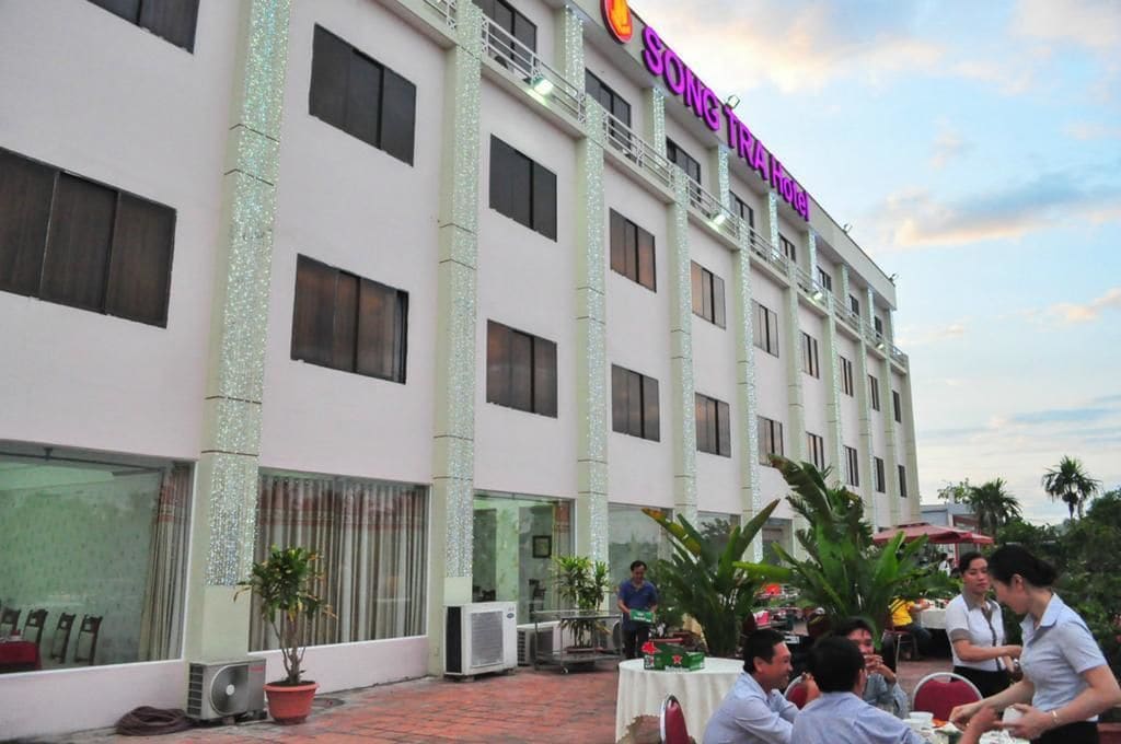 A hotel with a white exterior, multiple floors, and a sign that reads "SONTRA Hotel".