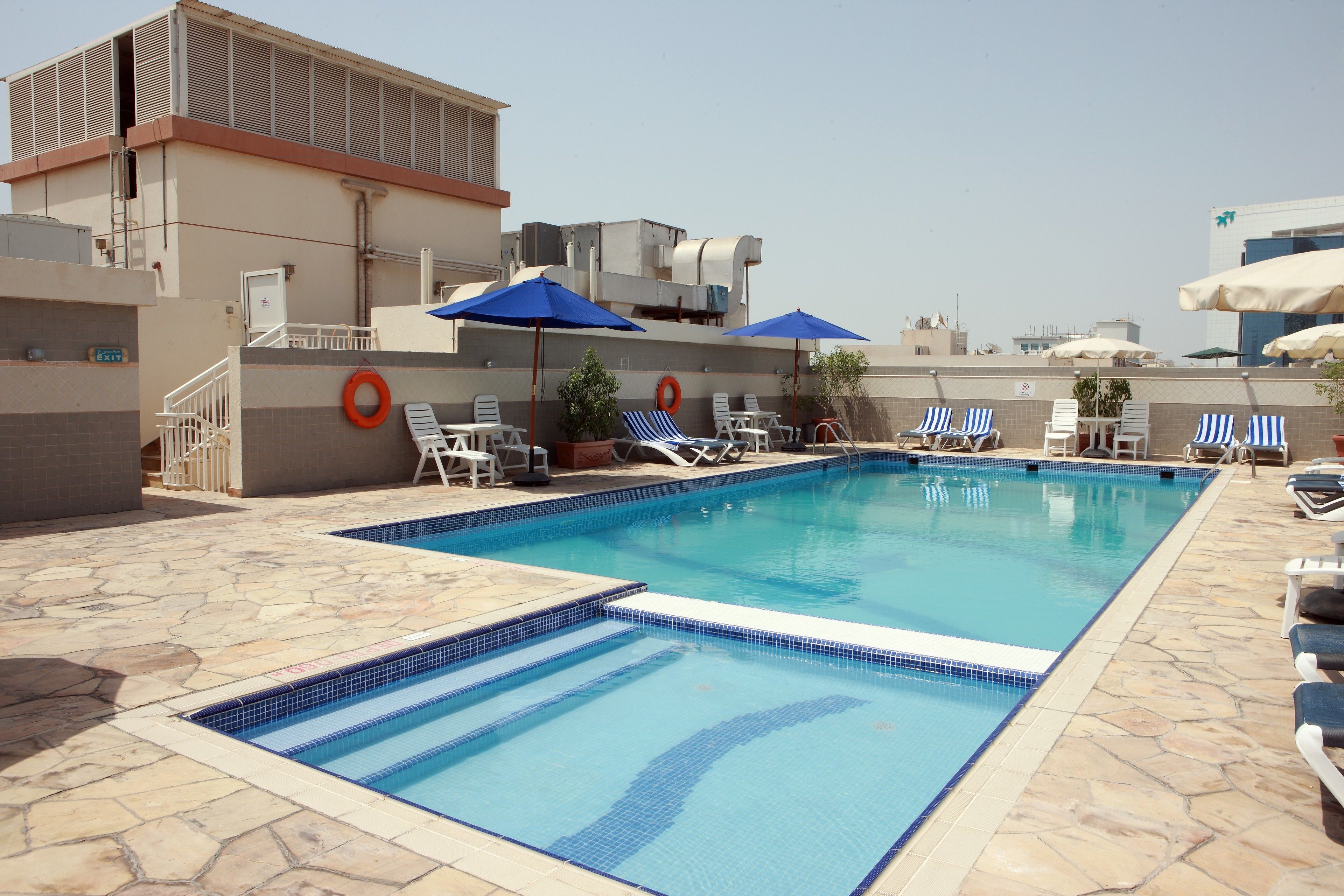Outdoor pool, open 10:00 AM to 8:00 PM, pool umbrellas, pool loungers