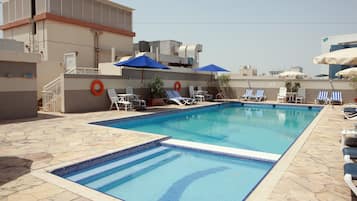 Outdoor pool, open 9:00 AM to 8:00 PM, pool umbrellas, pool loungers